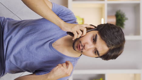 Vertical-video-of-Angry-man-talking-on-the-phone.